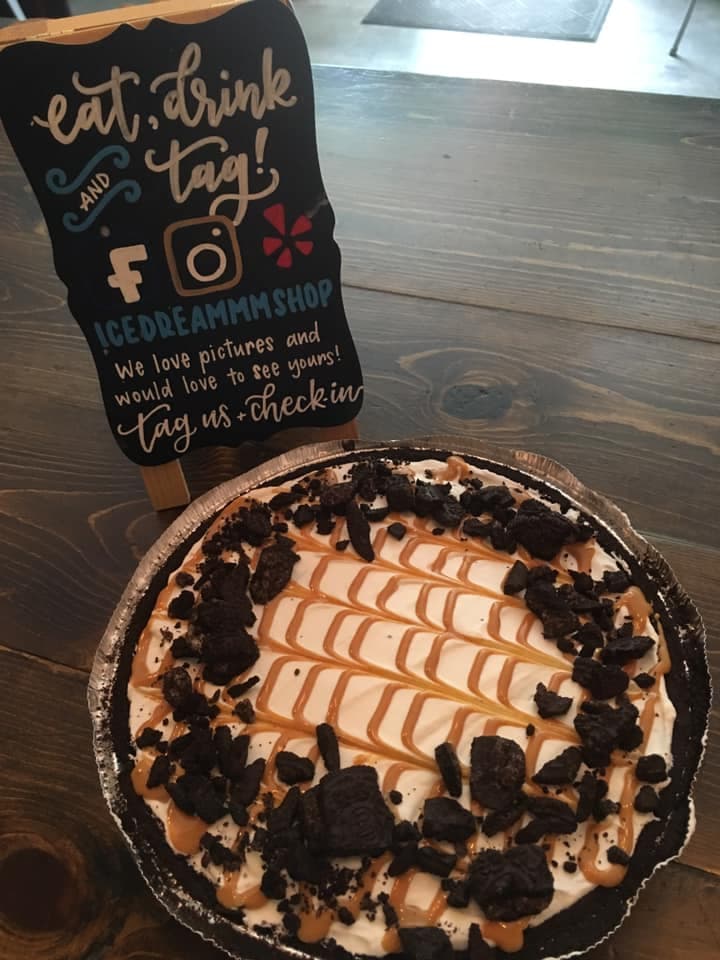 Homemade ice cream pie topped with cookie crumbles and caramel drizzle