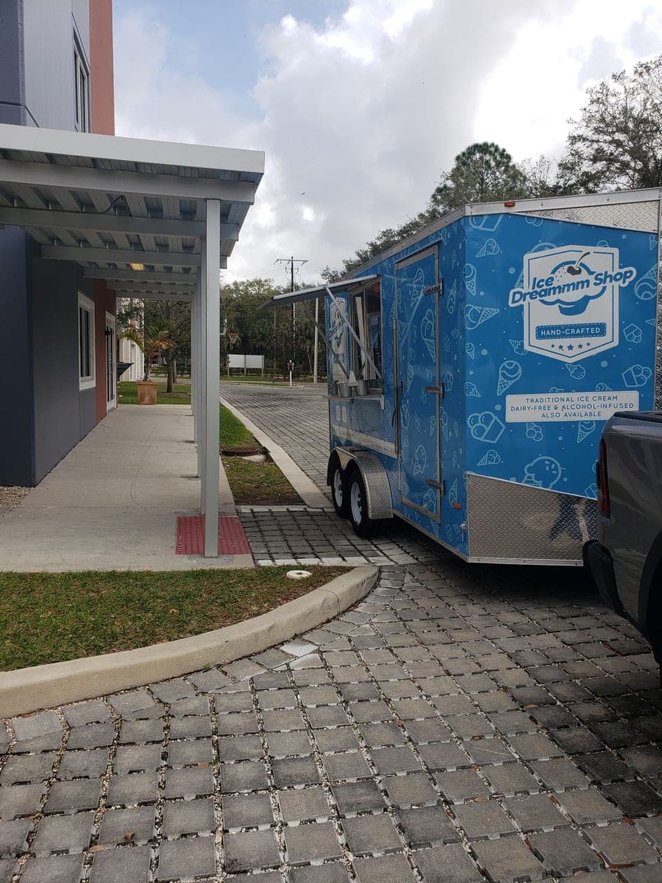 Blue ice cream trailer parked for a school event