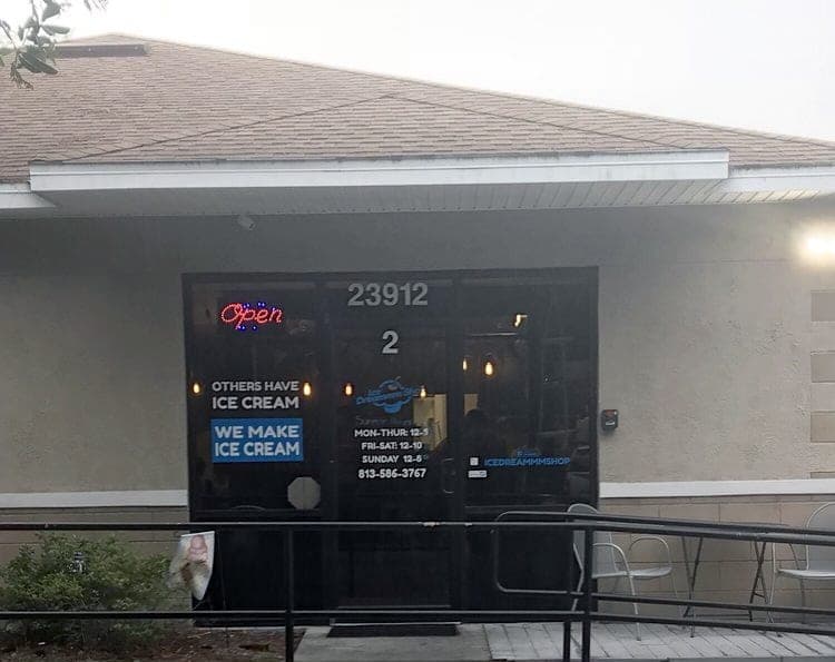 Front door of the Lutz shop, with "Others have ice cream, we make ice cream" on the window